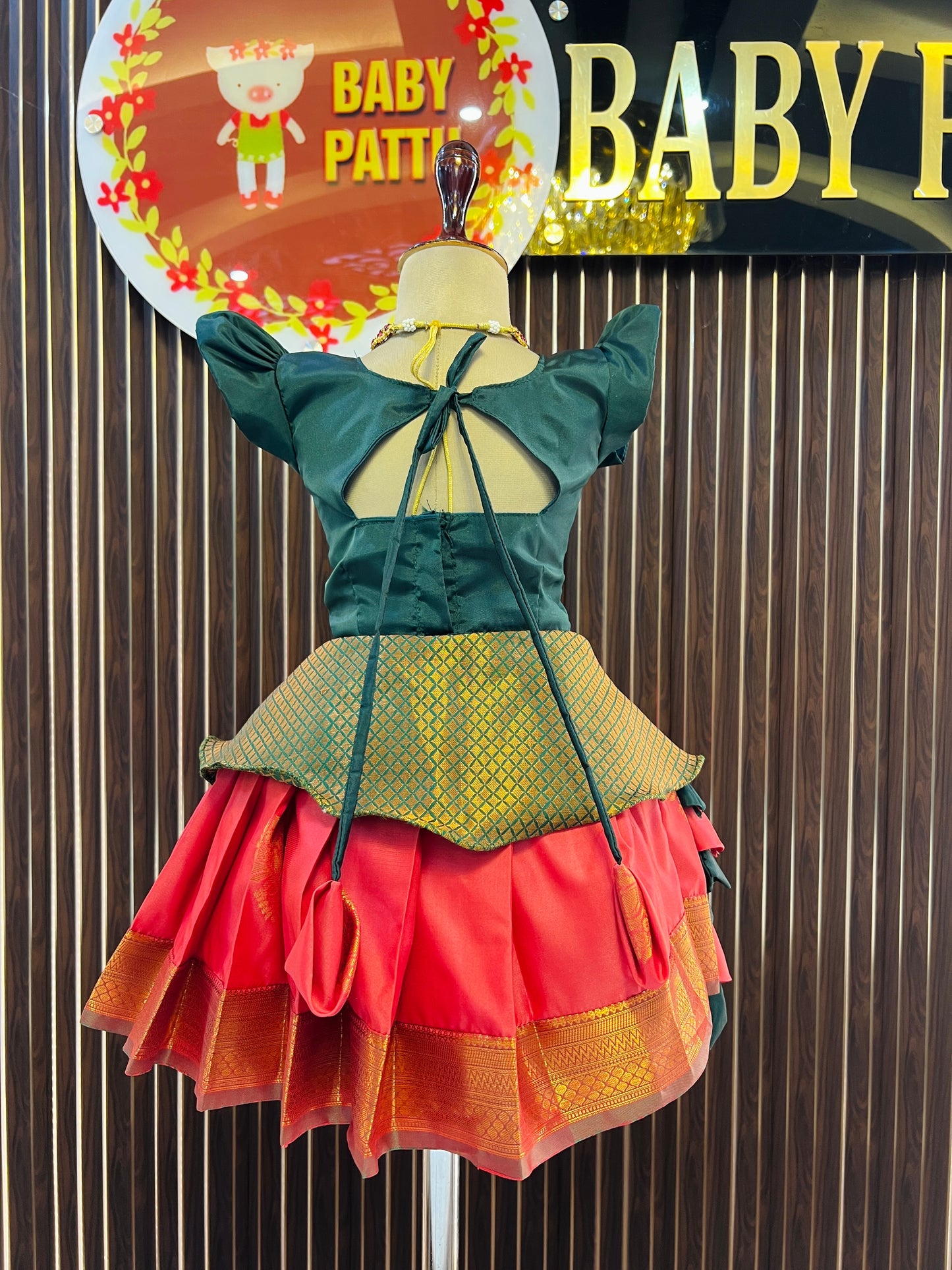 Green Peplum Top and Orange Pattu Pavada