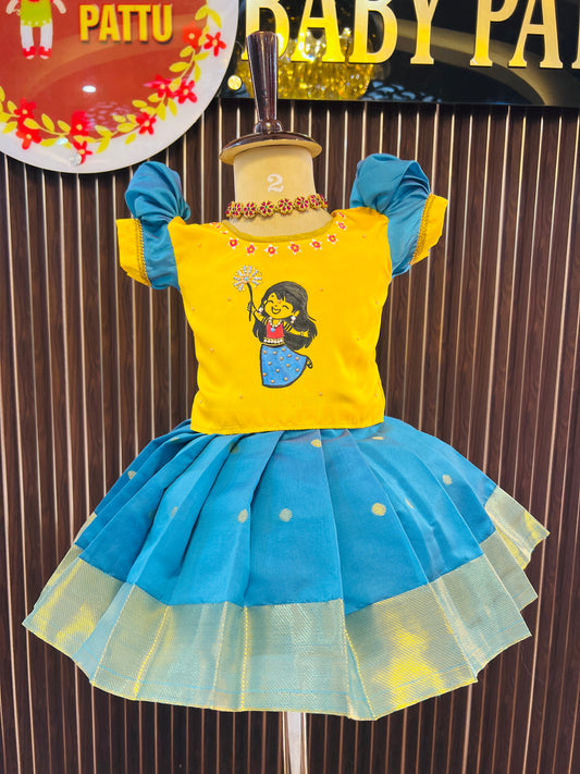 Yellow Top And Rin Blue Bottom Pattu Pavada - Hand painted crackers themed Diwali Collections 2025