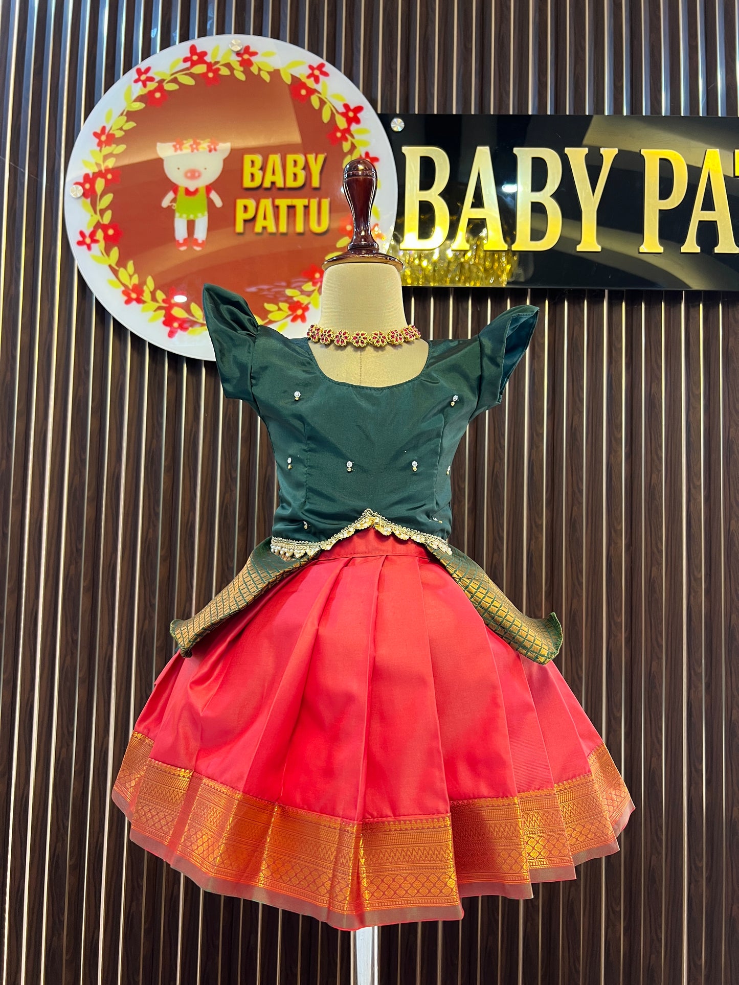 Green Peplum Top and Orange Pattu Pavada