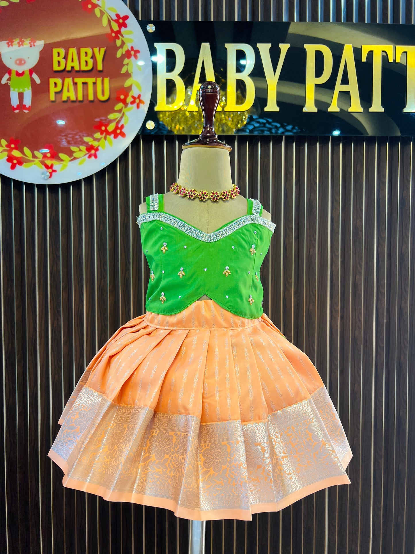 Green Color Crop Top And Lite Orange Bottom Pattu Pavada